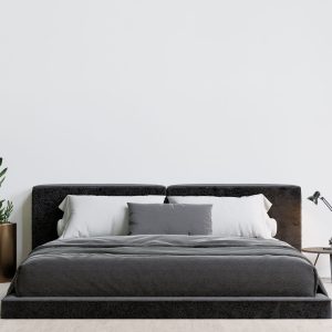 Made by elix Contemporary bedroom with a luxurious bed, decorative plants, and a table lamp.
